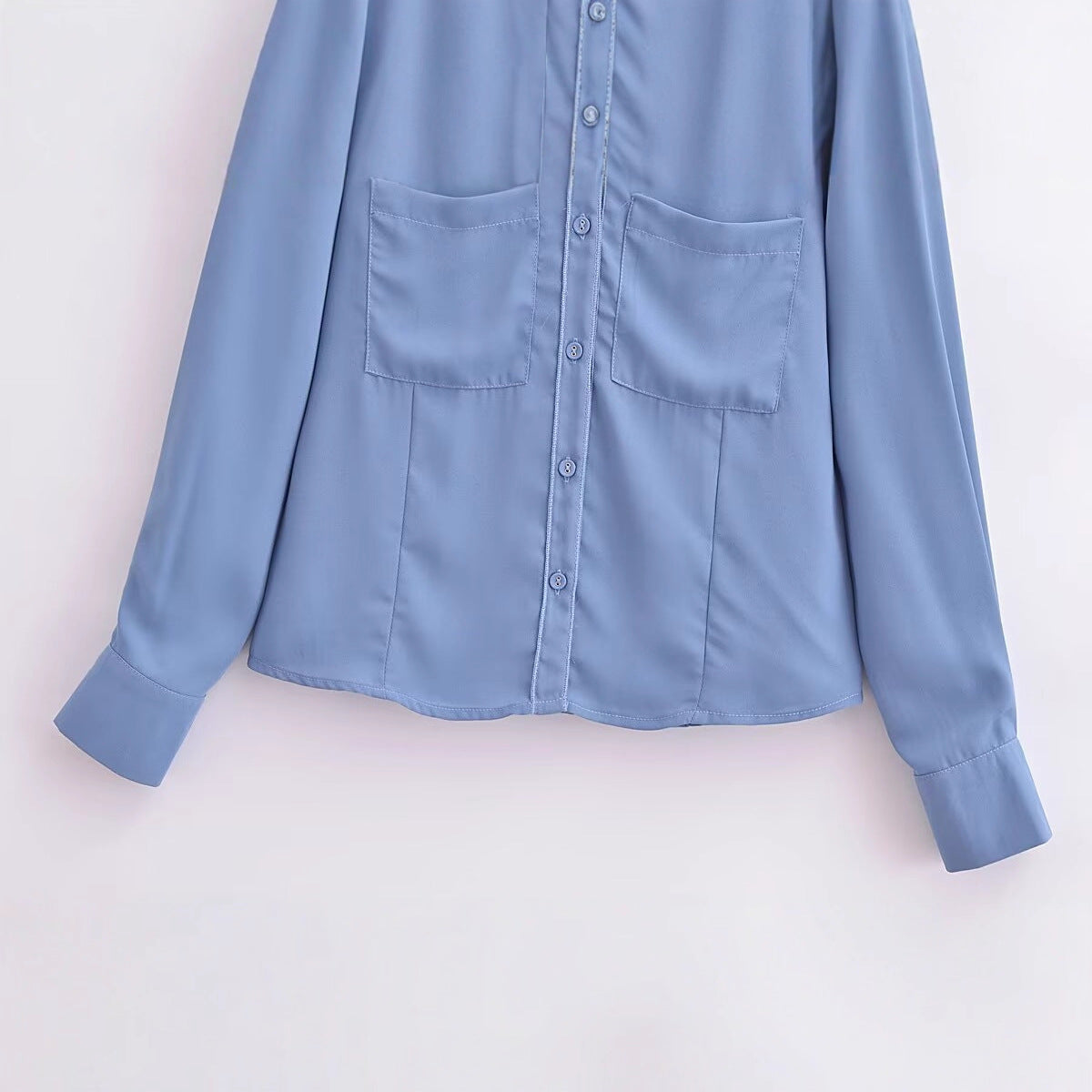 Long sleeved blue pocket embellished crepe shirt