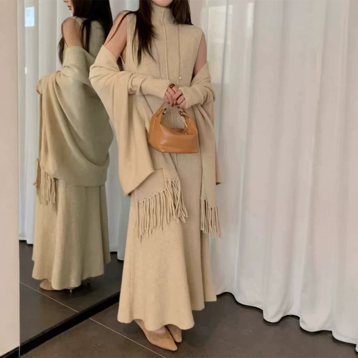 Wear a sleeveless high neck slim fitting jumpsuit long dress