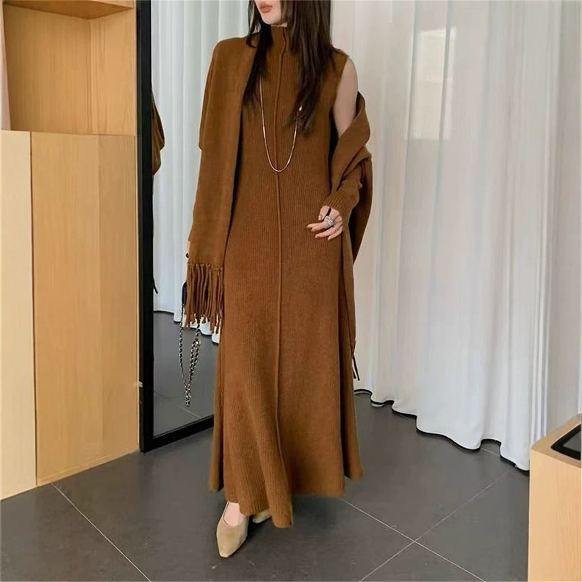 Wear a sleeveless high neck slim fitting jumpsuit long dress