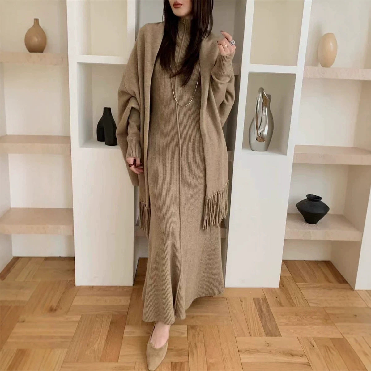 Wear a sleeveless high neck slim fitting jumpsuit long dress