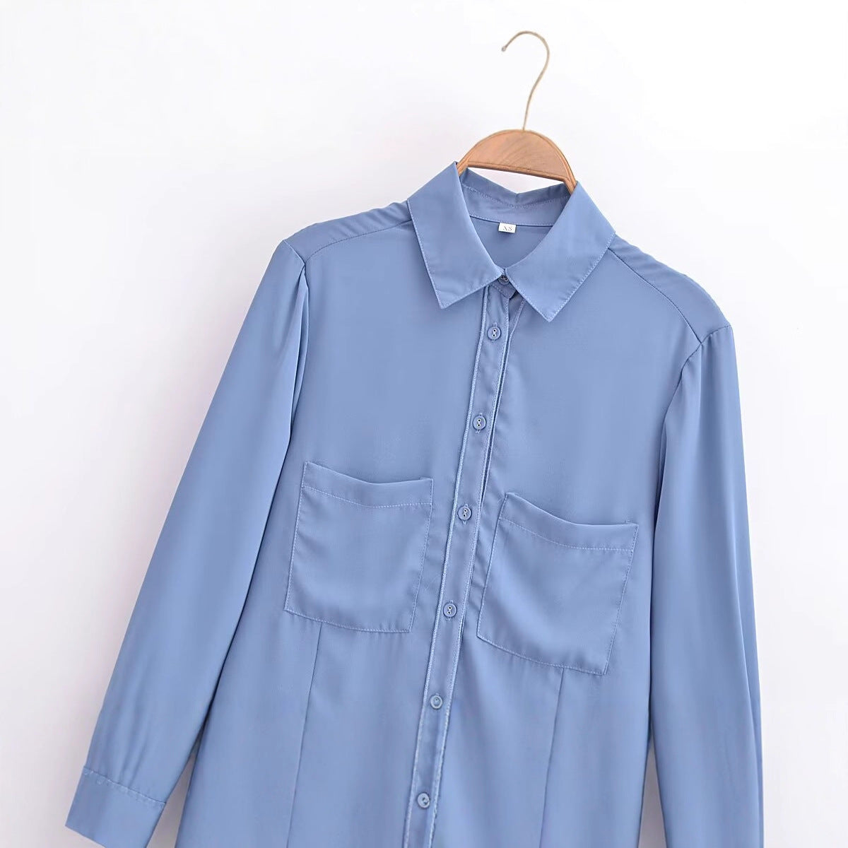 Long sleeved blue pocket embellished crepe shirt